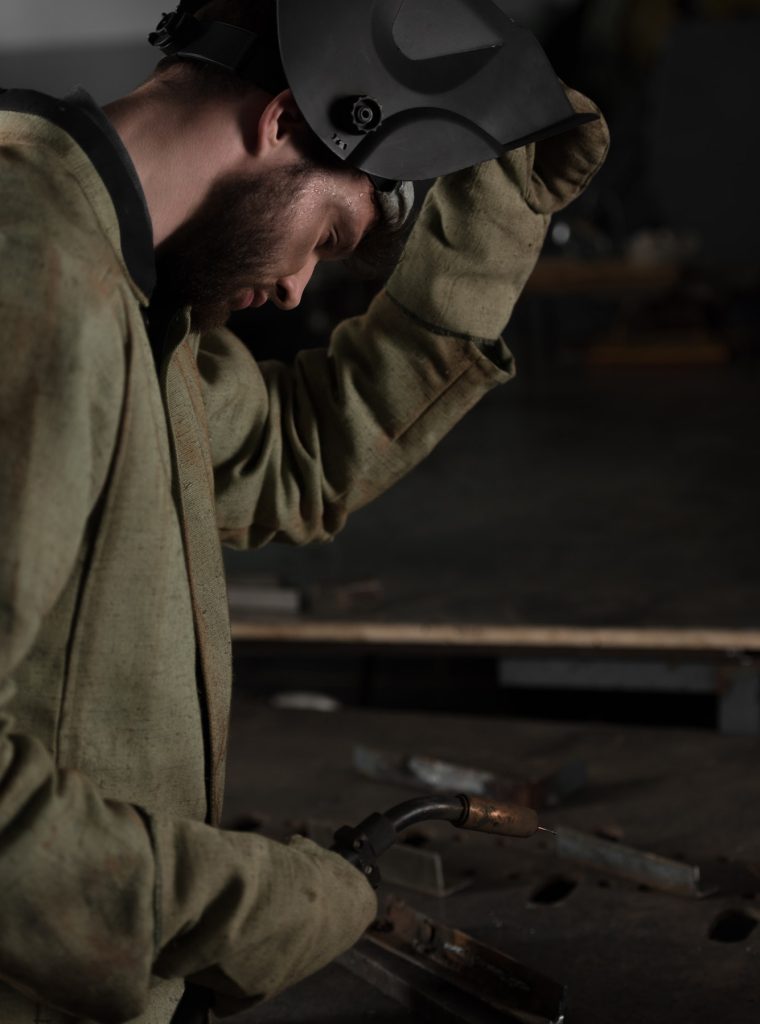 Side View Of Welder Lifting Up Protective Mask To Look At His Work Rjc1135jzwx0cd5giznfc1fjuk88ysjka36n0rjjsw